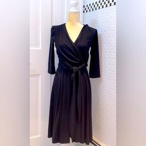 Melissa Masse black faux wrap jersey fit and dress.Rayon/Poly/Spandex. M.